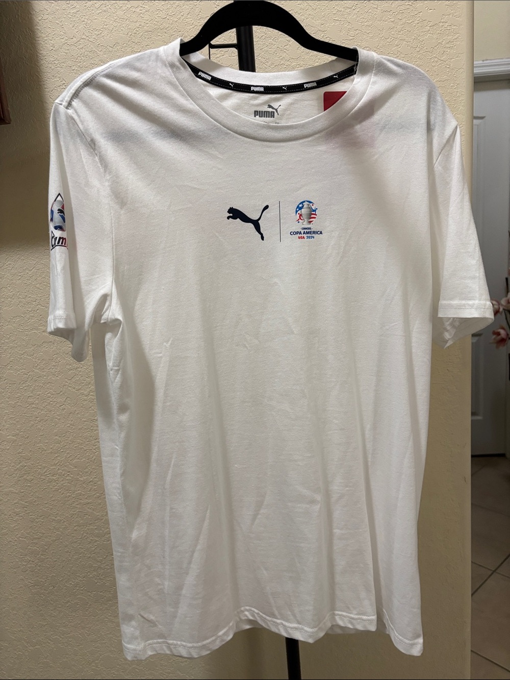 Puma White Copa America USA 2024 Cumbre Soccer Logo Short Sleeve Tee
